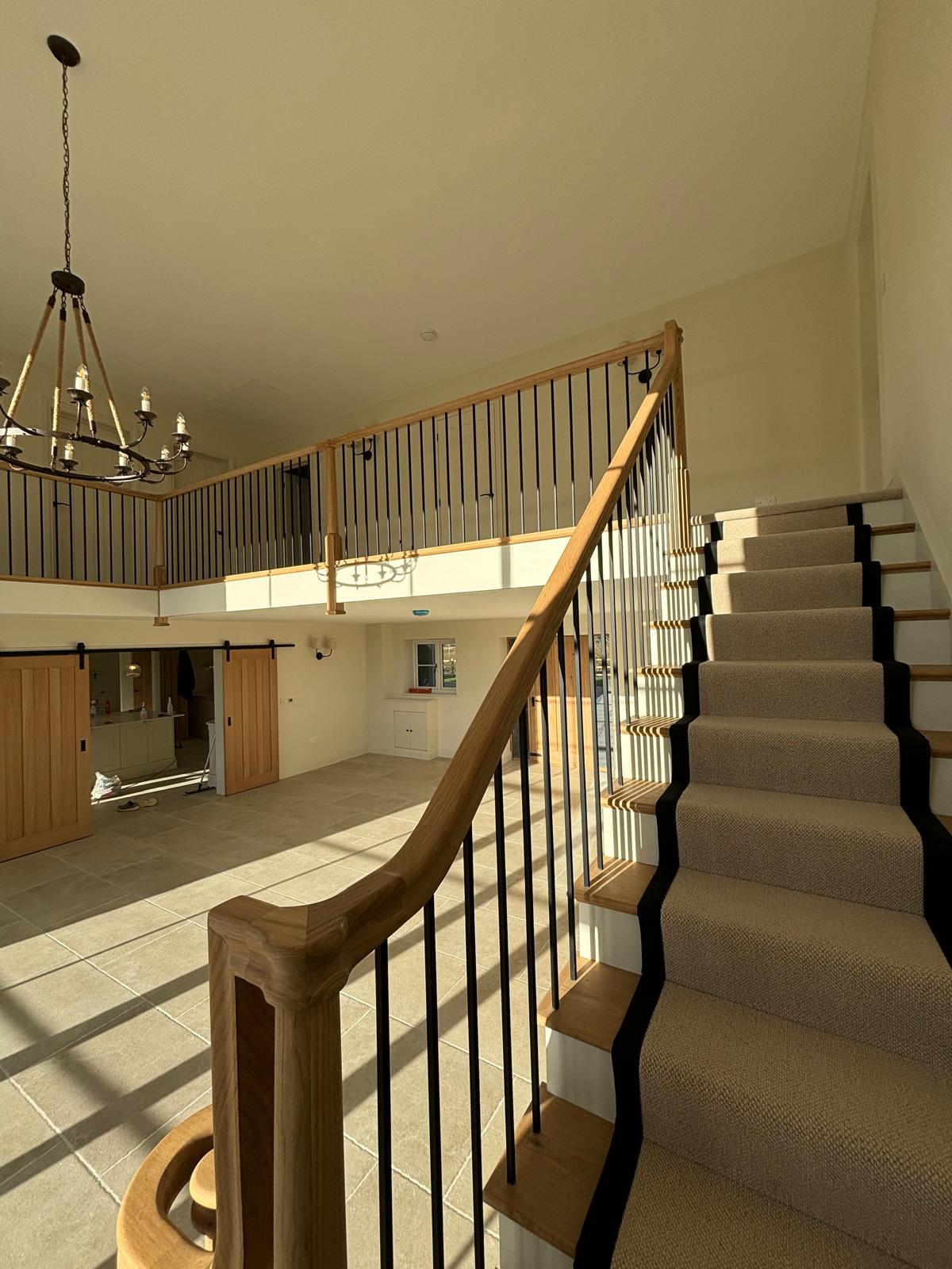 Double height entrance hall staircase cleaned after construction work