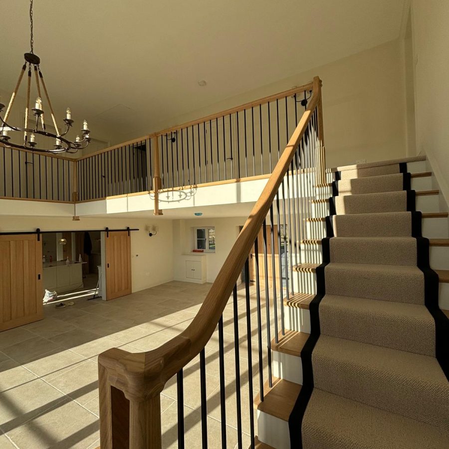 Double height entrance hall staircase cleaned after construction work